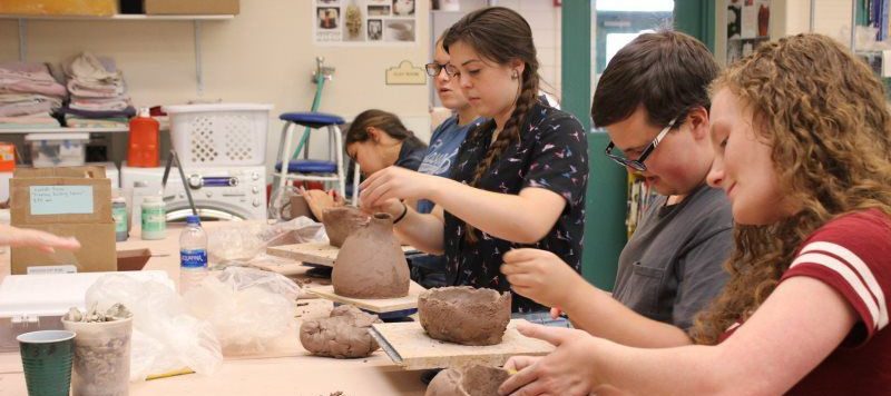 Art students using clay.